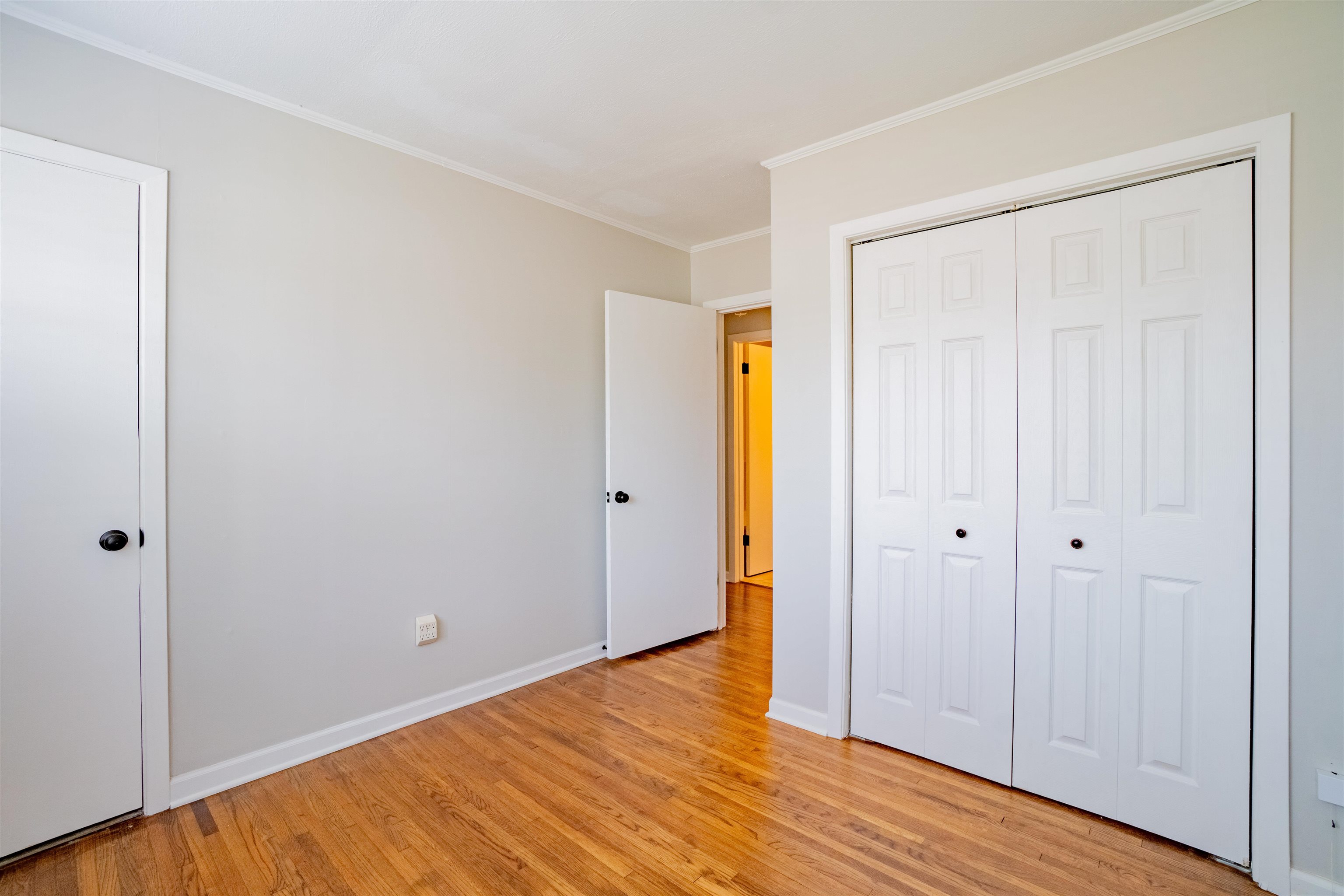 1349 Colonial Road Memphis, TN 38117 - Photo 21 of 29 a view of an empty room with wooden floor