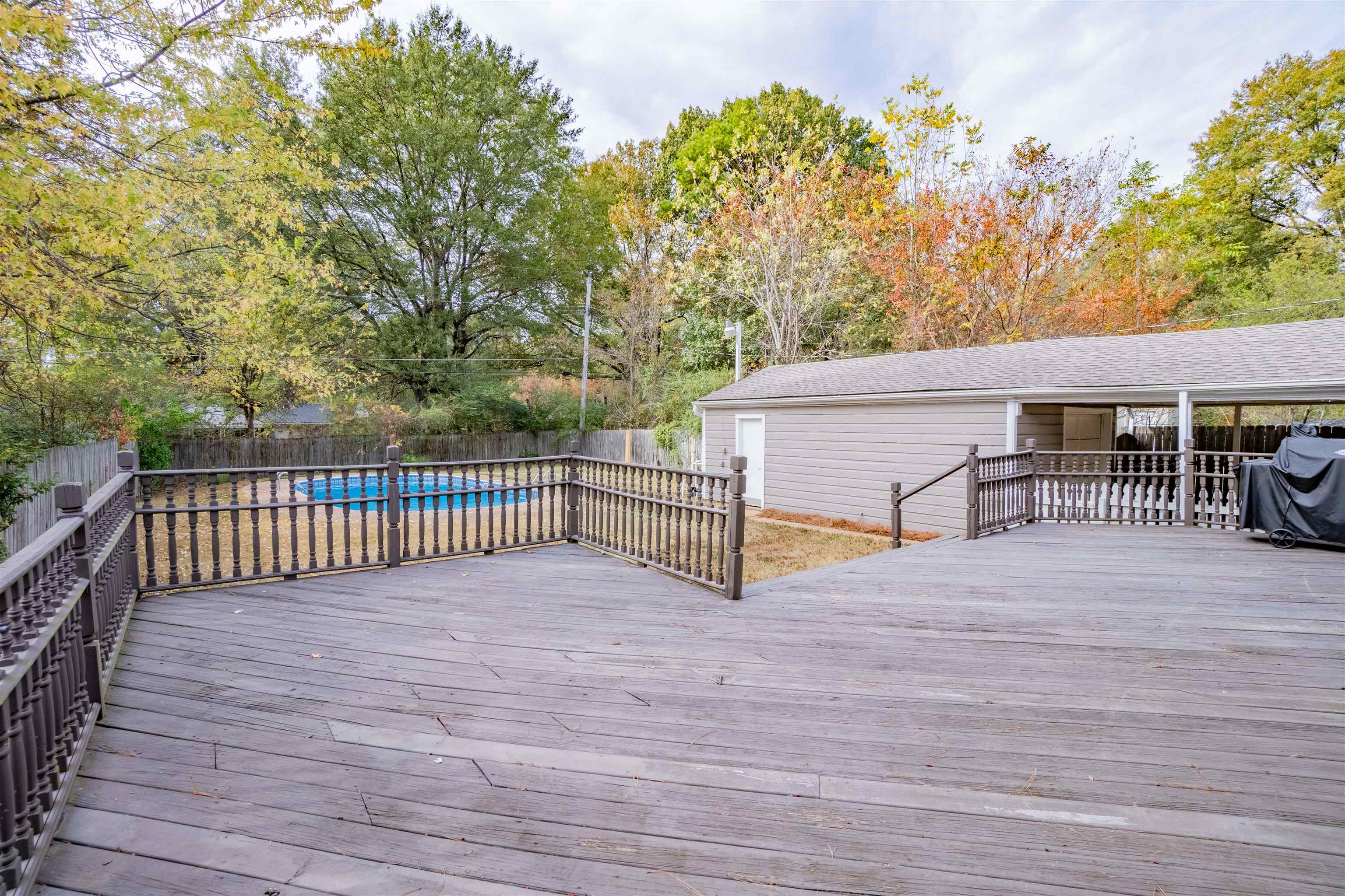 1349 Colonial Road Memphis, TN 38117 - Photo 23 of 29 a view of backyard with deck and a garden