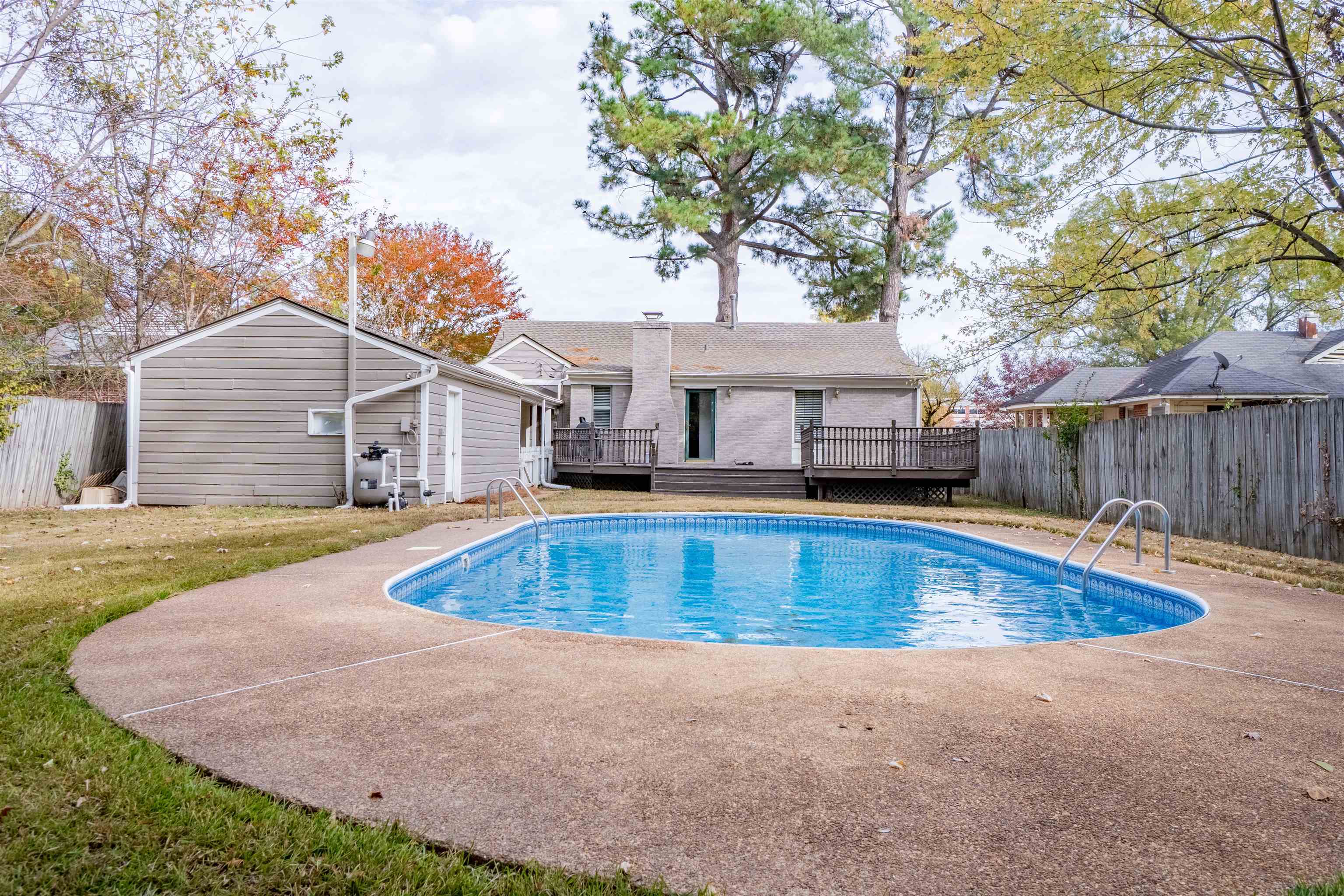 1349 Colonial Road Memphis, TN 38117 - Photo 24 of 29 a view of a house with swimming pool and sitting area