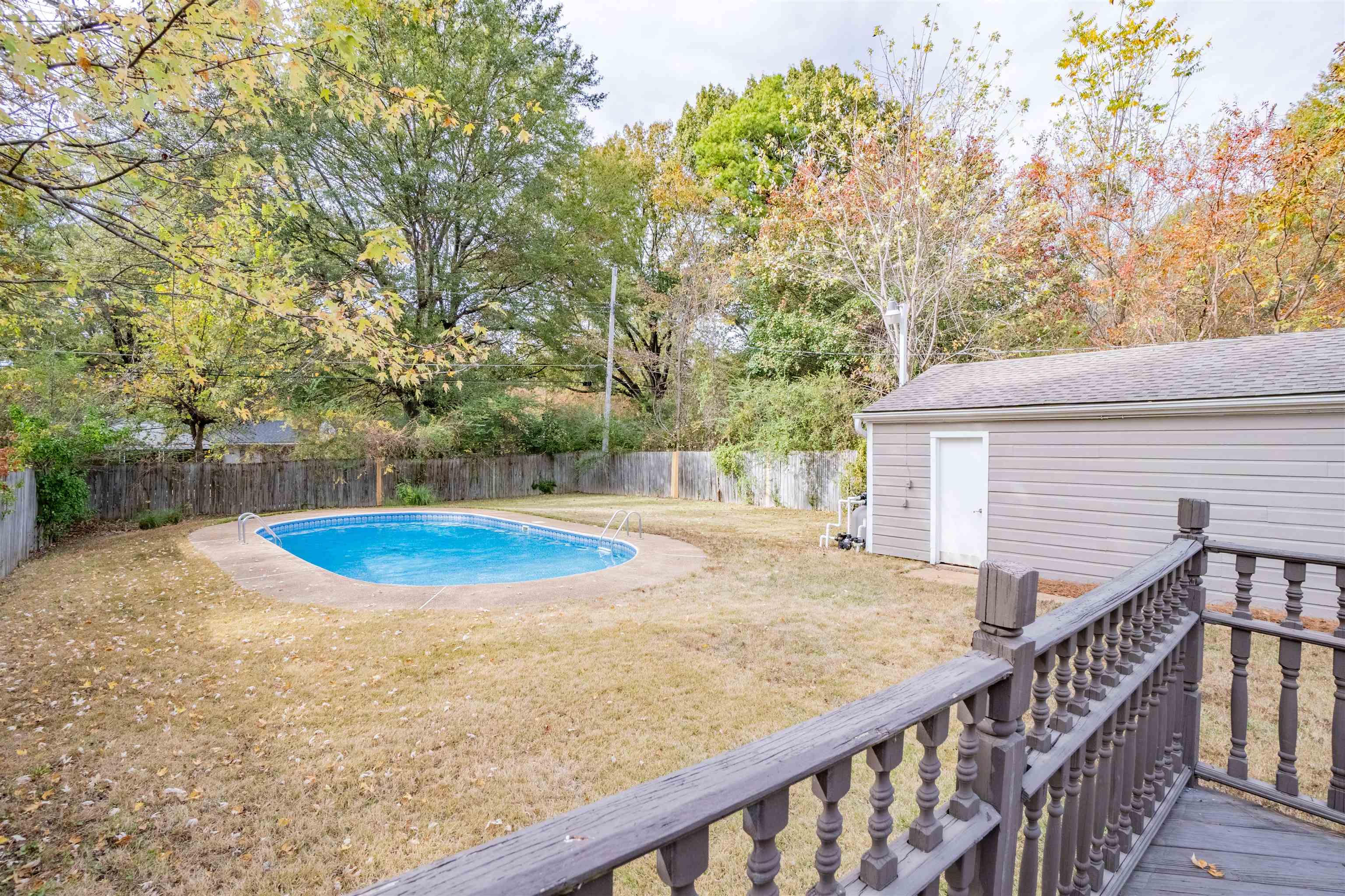 1349 Colonial Road Memphis, TN 38117 - Photo 25 of 29 a view of a backyard with two trees