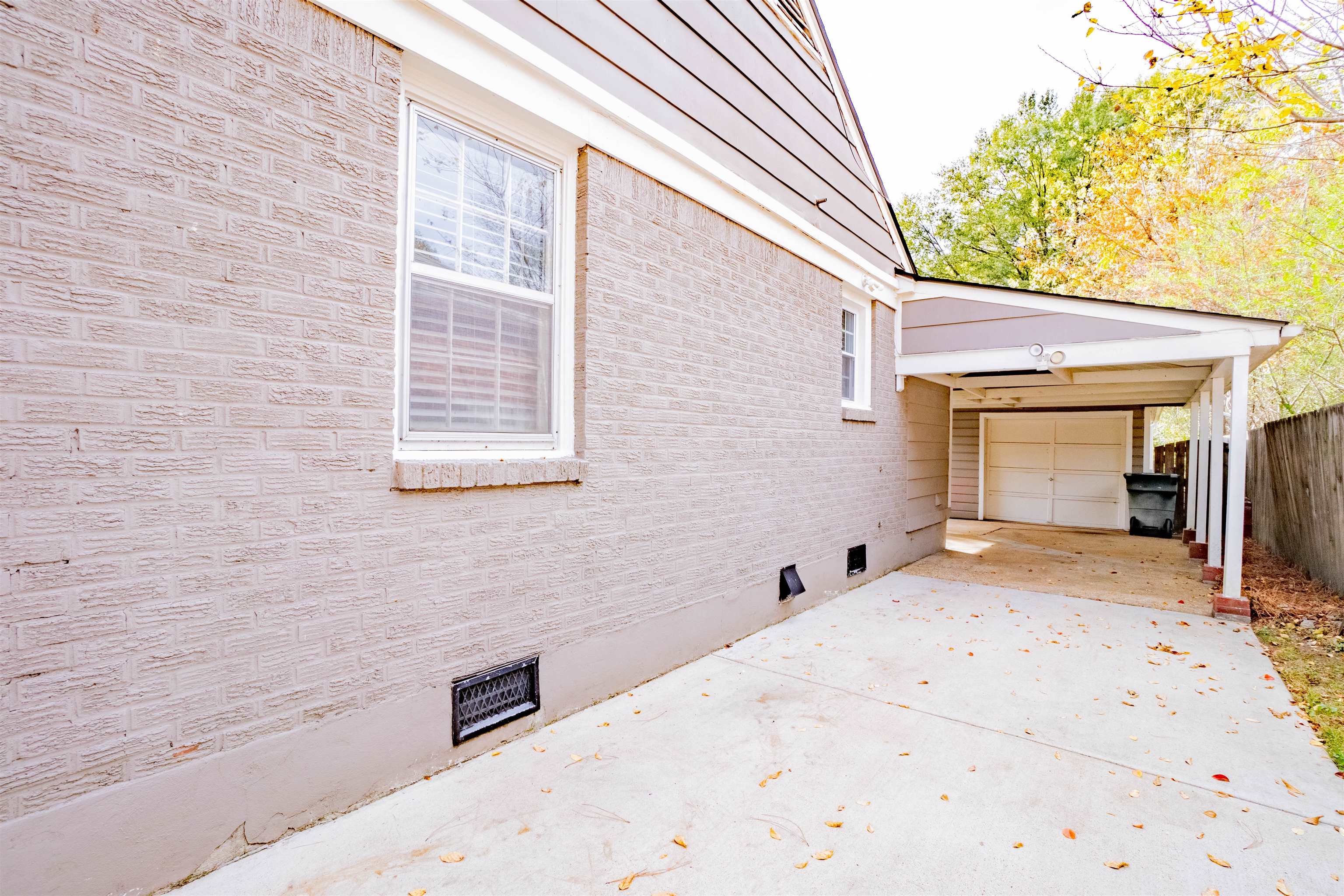1349 Colonial Road Memphis, TN 38117 - Photo 27 of 29 a view of house with backyard and trees in the background