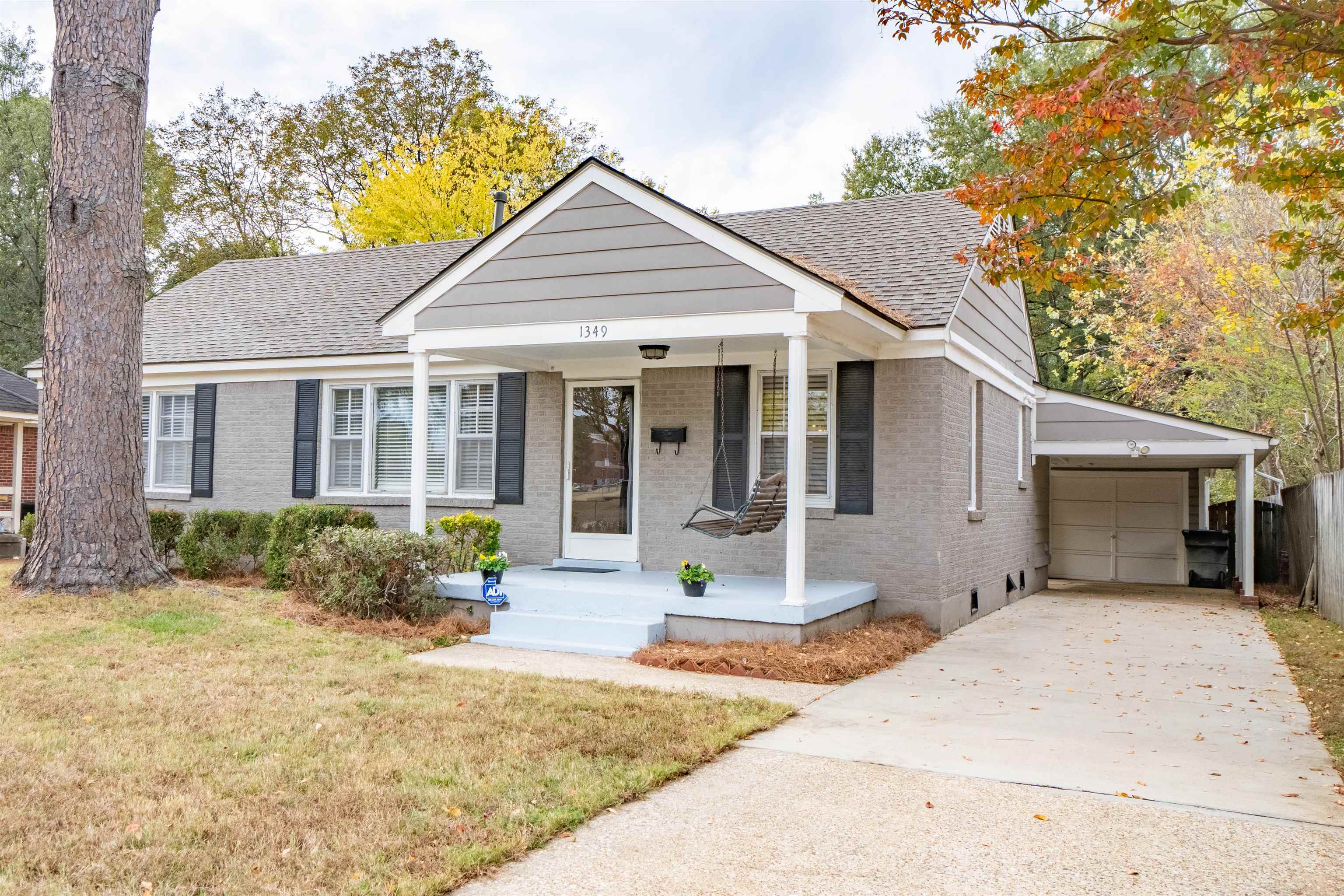 1349 Colonial Road Memphis, TN 38117 - Photo 3 of 29 a front view of a house with yard patio and glass windows