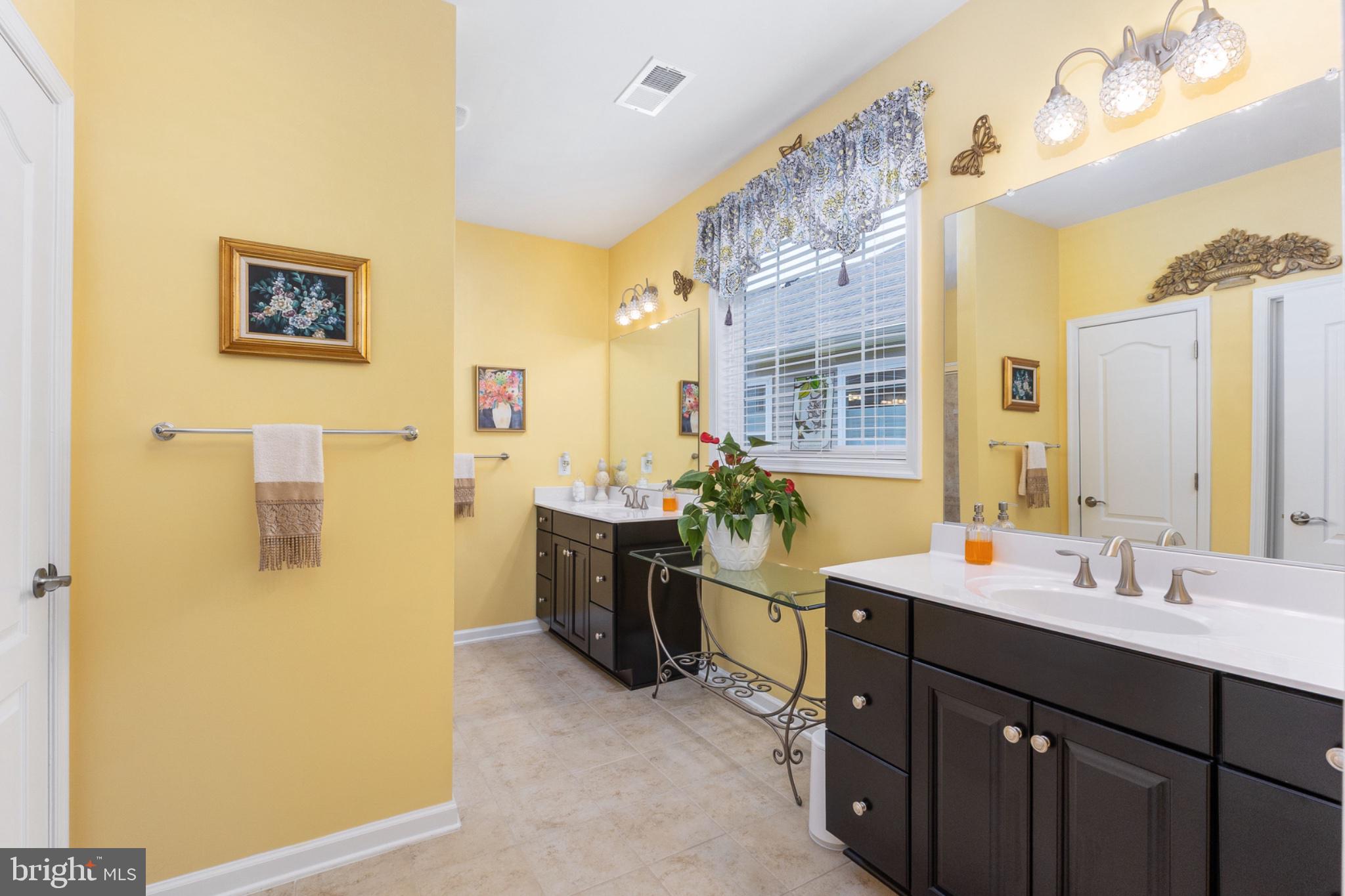 6012 New Berne Road Fredericksburg, VA 22407 - Photo 23 of 41 a bathroom with a double vanity sink mirror and shower