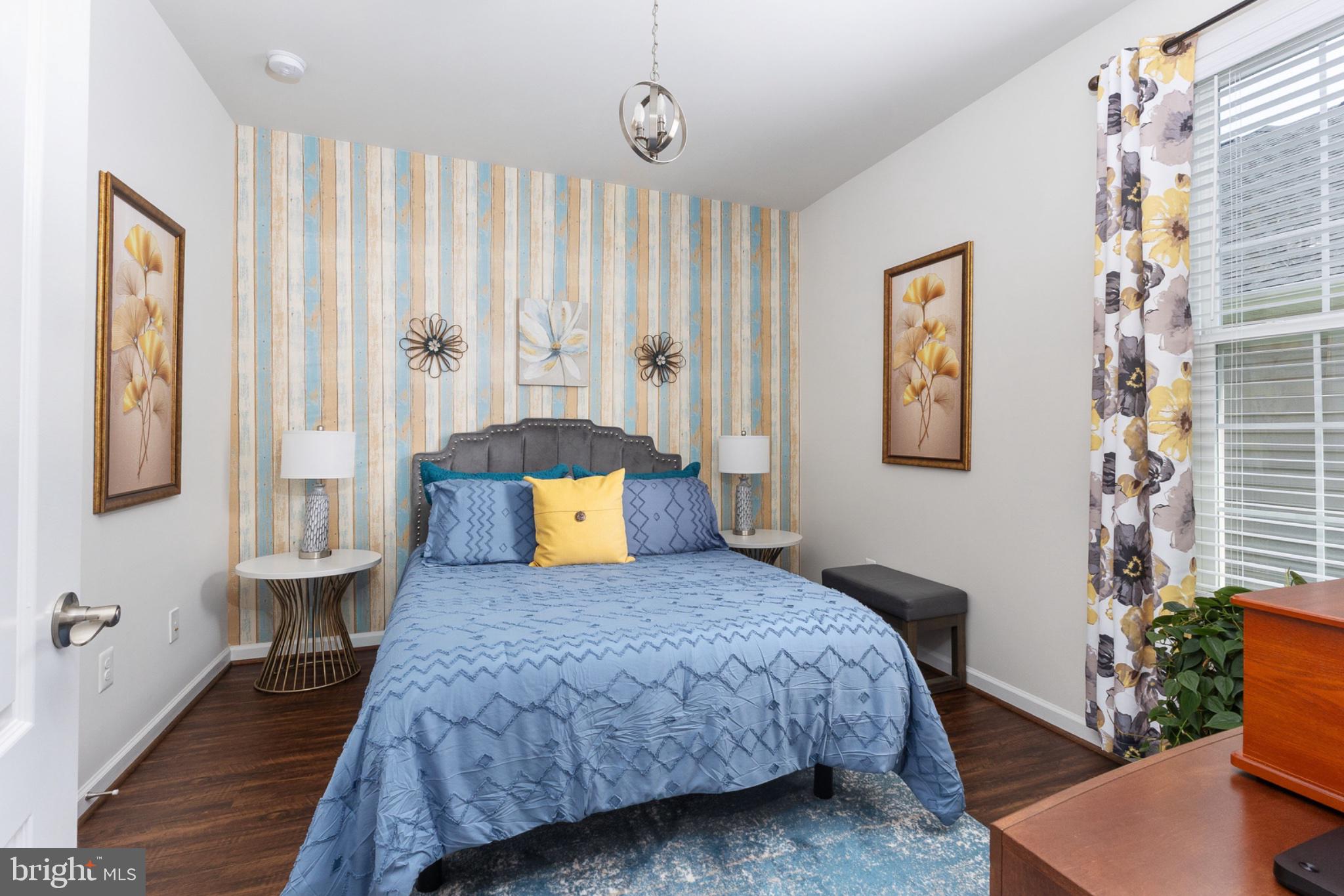6012 New Berne Road Fredericksburg, VA 22407 - Photo 24 of 41 a bedroom with a large bed and a chandelier