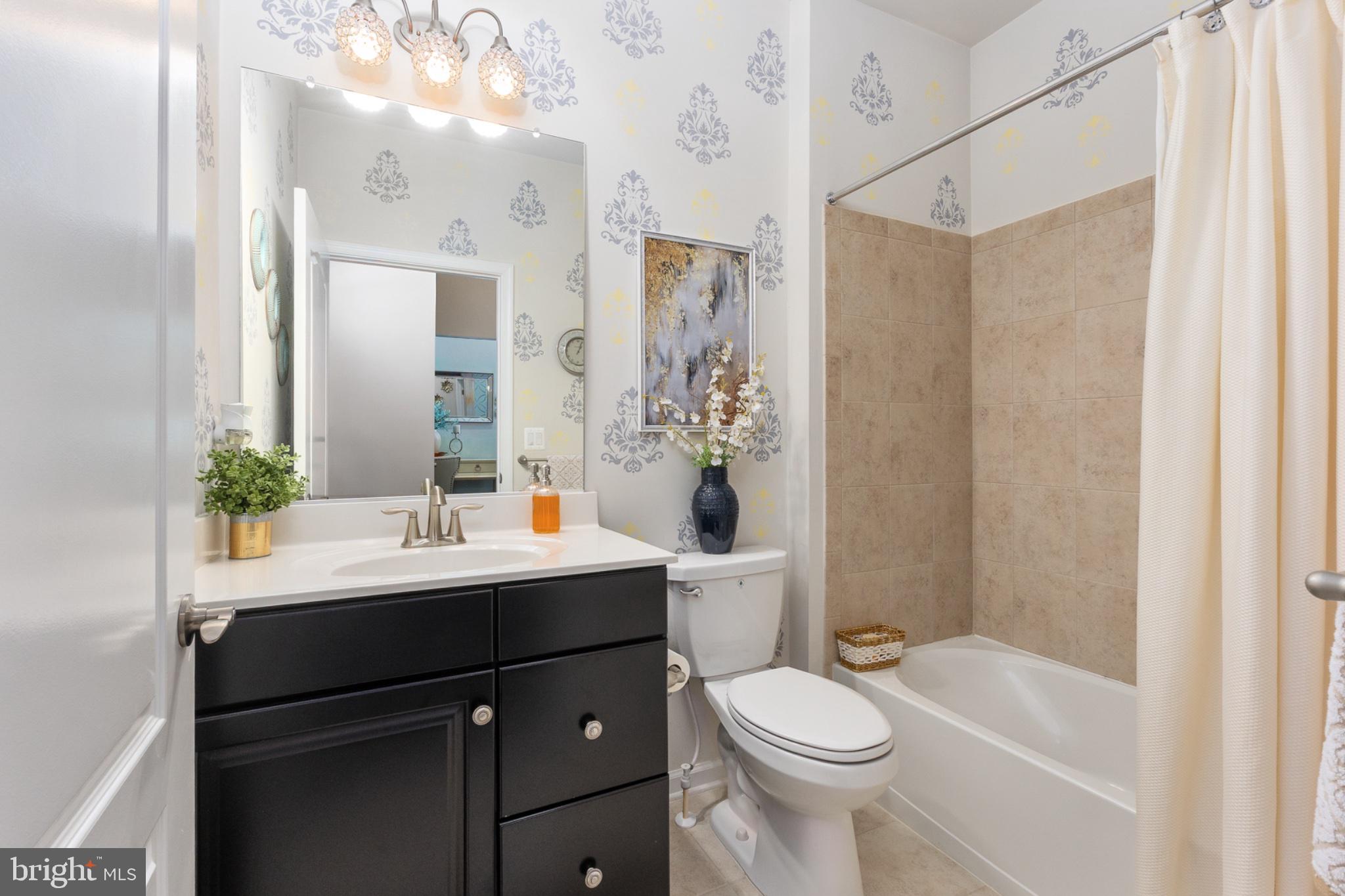 6012 New Berne Road Fredericksburg, VA 22407 - Photo 26 of 41 a bathroom with a sink toilet and shower