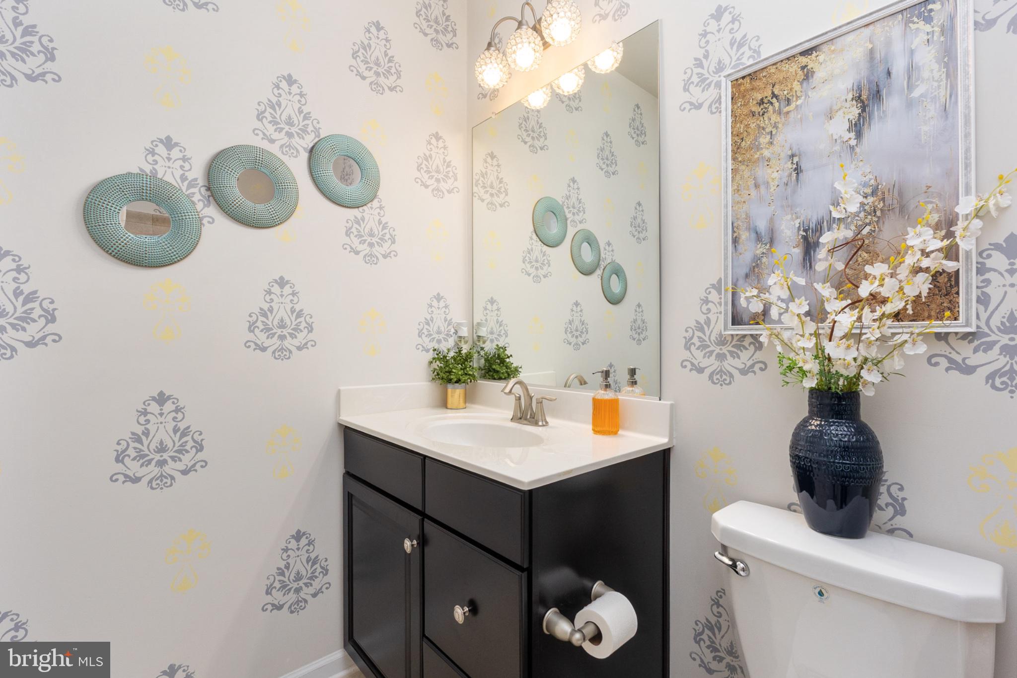 6012 New Berne Road Fredericksburg, VA 22407 - Photo 27 of 41 a bathroom with a sink a toilet and shower curtain