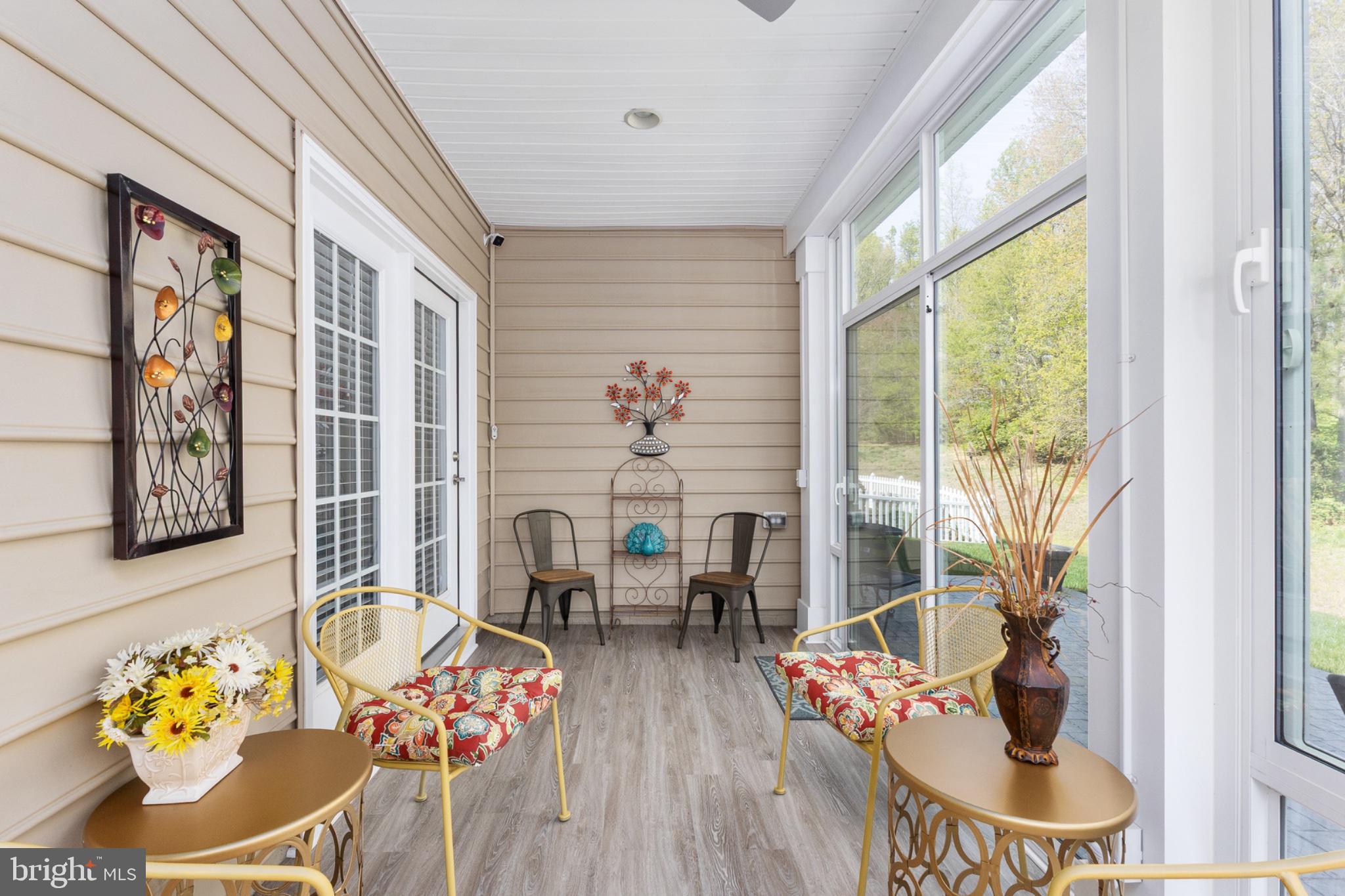 6012 New Berne Road Fredericksburg, VA 22407 - Photo 31 of 41 a living room with furniture and floor to ceiling windows