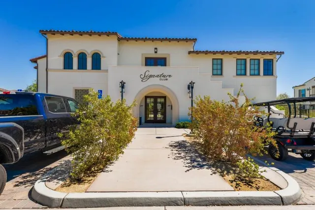 a view of living room with furniture and a fireplace