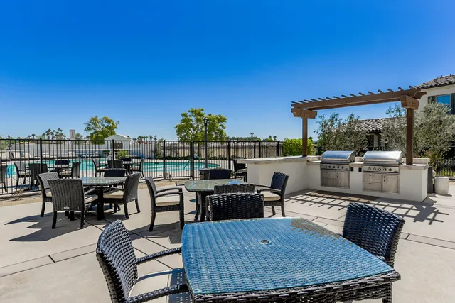 a view of a tables and chairs in patio