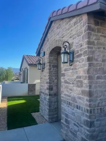 a brick building with a yard