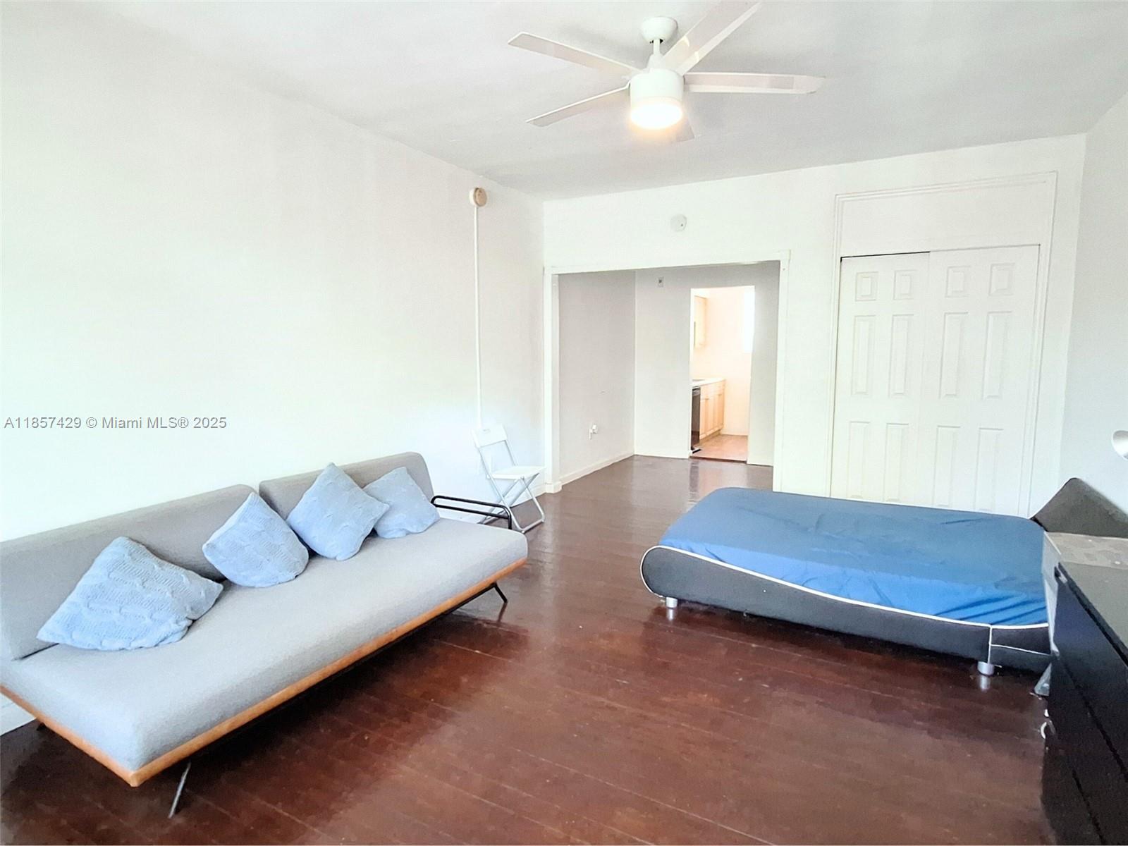 1770 Meridian Avenue, Unit 213 Miami Beach, FL 33139 - Photo 11 of 19 a living room with furniture and a window