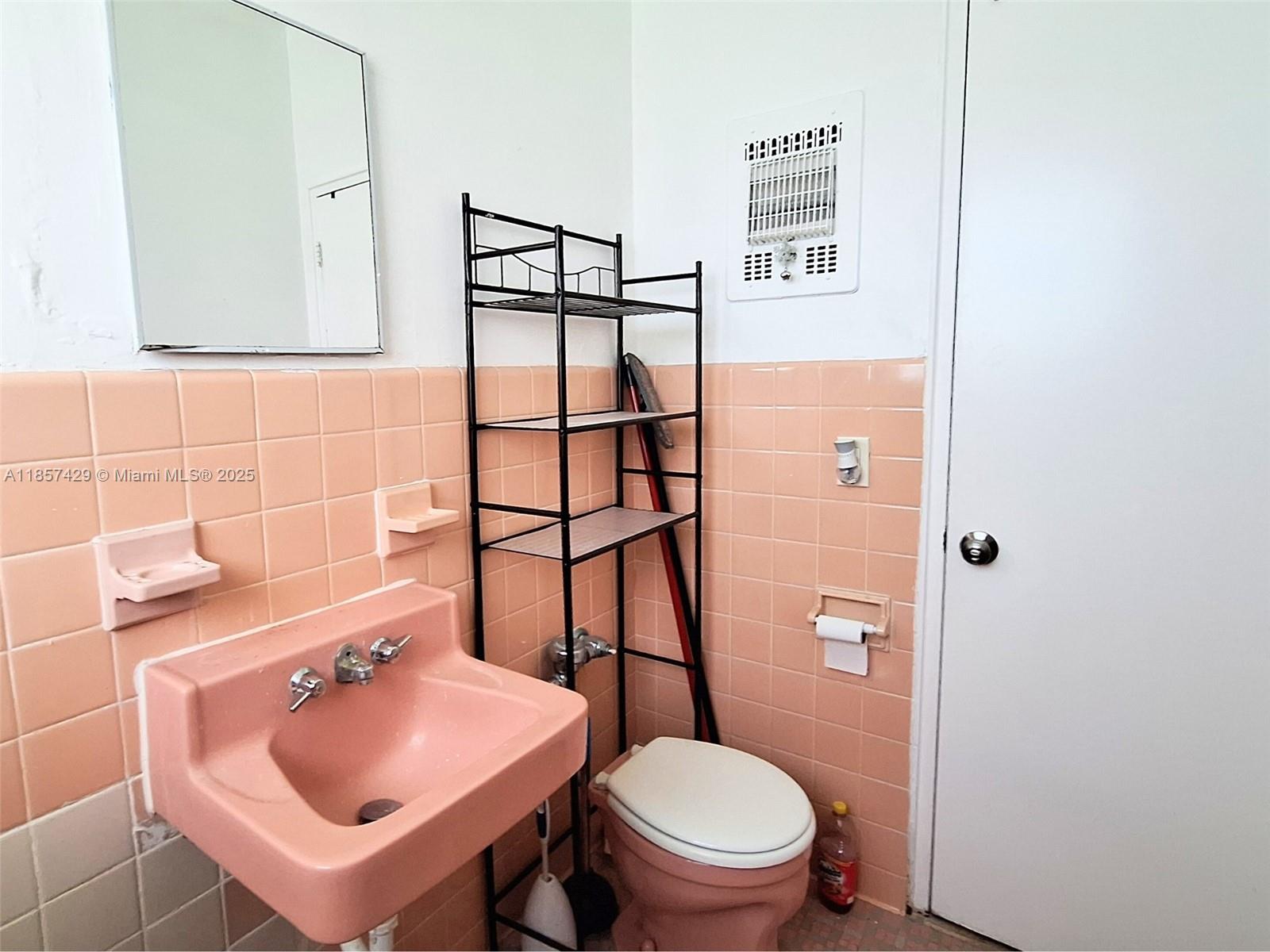 1770 Meridian Avenue, Unit 213 Miami Beach, FL 33139 - Photo 14 of 19 a bathroom with a sink toilet and shower