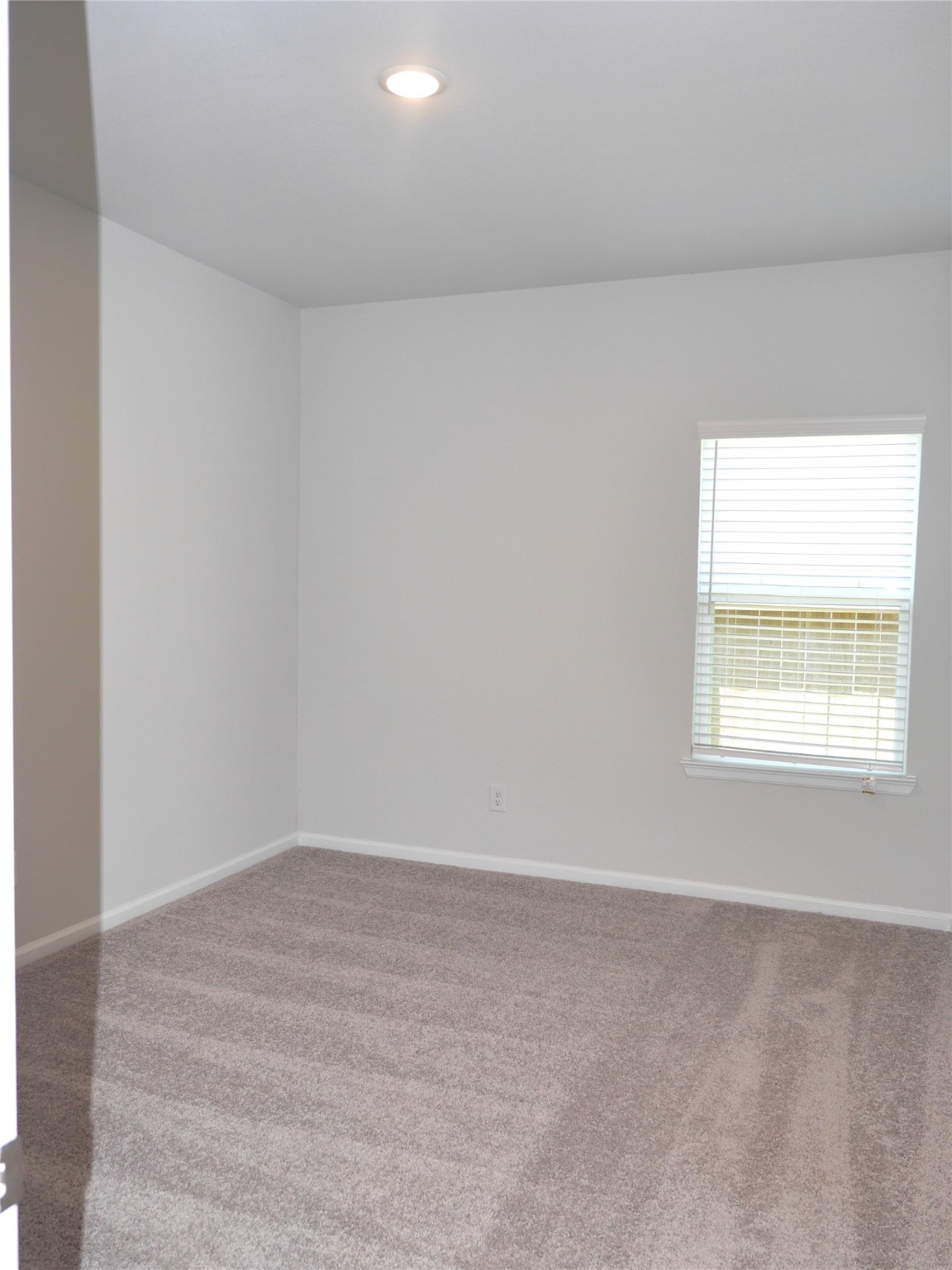 16839 Bristle Cone Way Conroe, TX 77302 - Photo 14 of 22 an empty room with a window