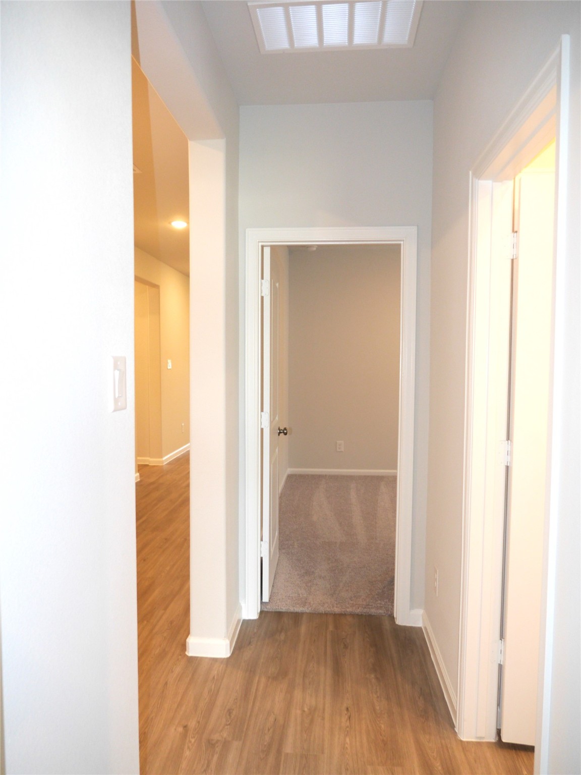 16839 Bristle Cone Way Conroe, TX 77302 - Photo 5 of 22 a view of a room with wooden floor and a bathroom