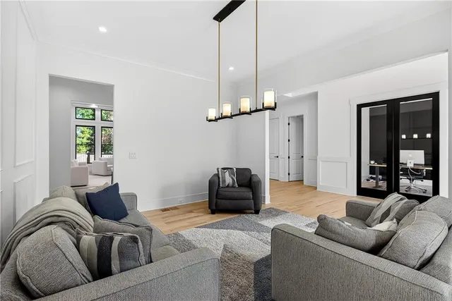 a spacious bedroom with a bed and a large window