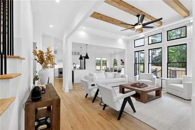 a view of a room with wooden floor and entryway