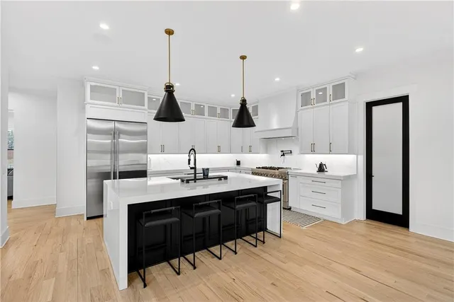 a bedroom with a bed and a ceiling fan