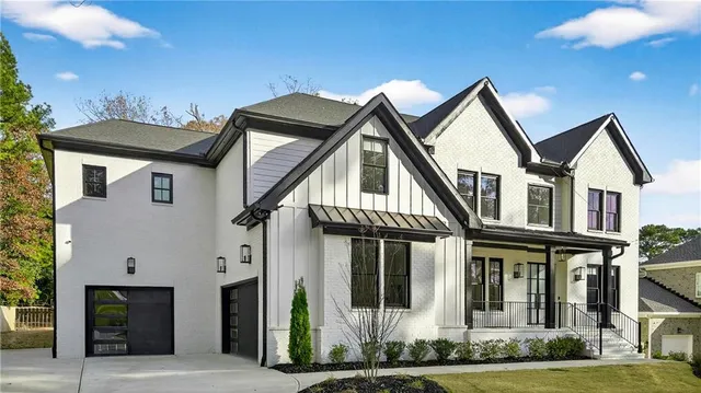 a aerial view of a house with a swimming pool