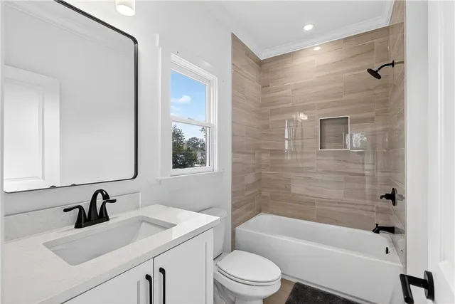 a front view of a house with a yard garage and outdoor seating