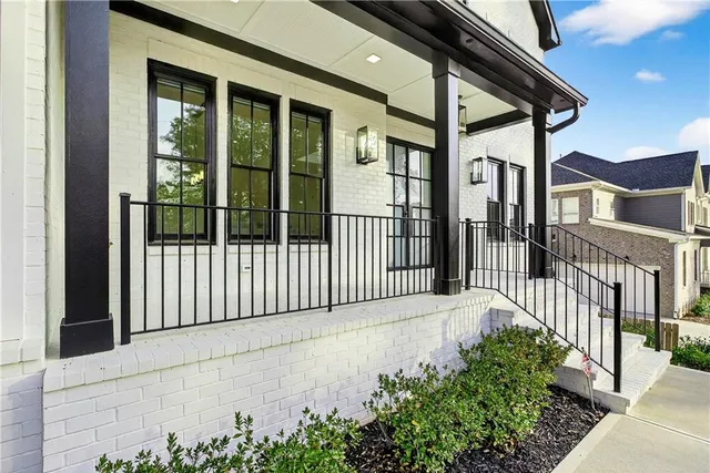 a living room with furniture ceiling fan and a window