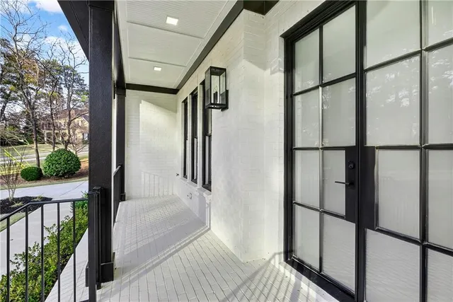 a living room with furniture dining table and a floor to ceiling window