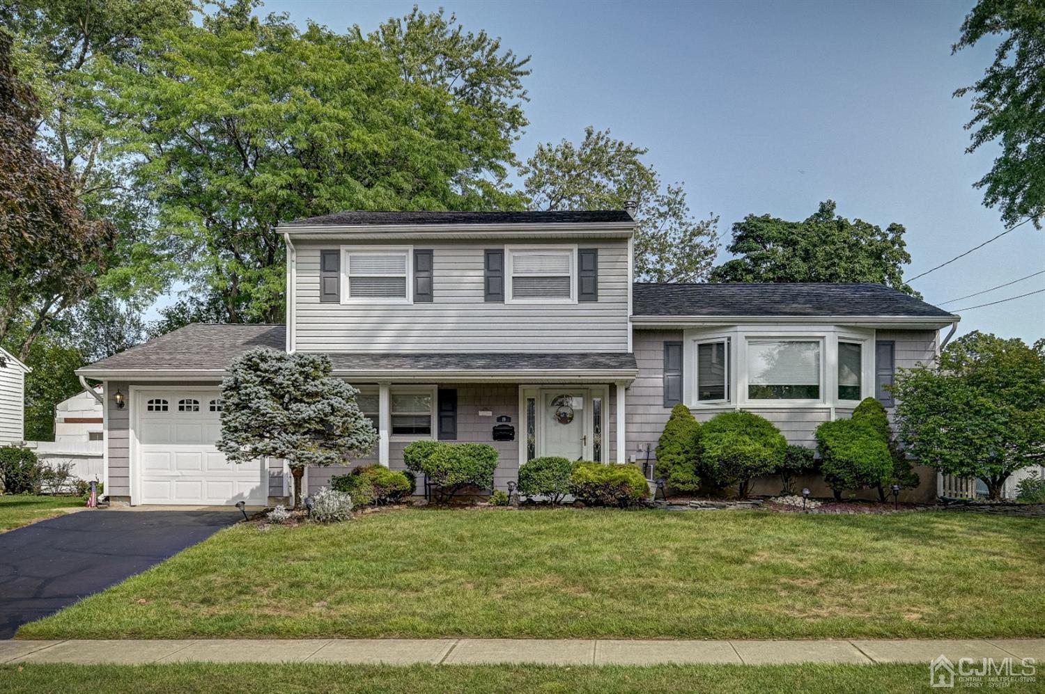 19 Chelsea Road Old Bridge, NJ 08857 - Photo 1 of 34 a front view of a house with a yard