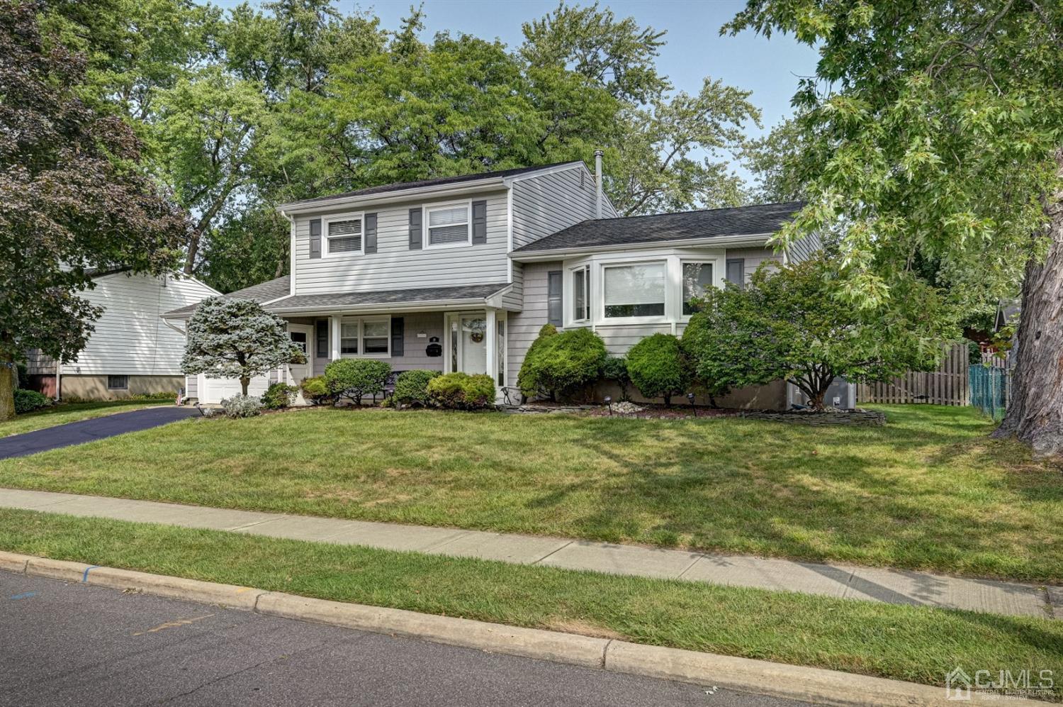 19 Chelsea Road Old Bridge, NJ 08857 - Photo 2 of 34 a front view of a house with a yard