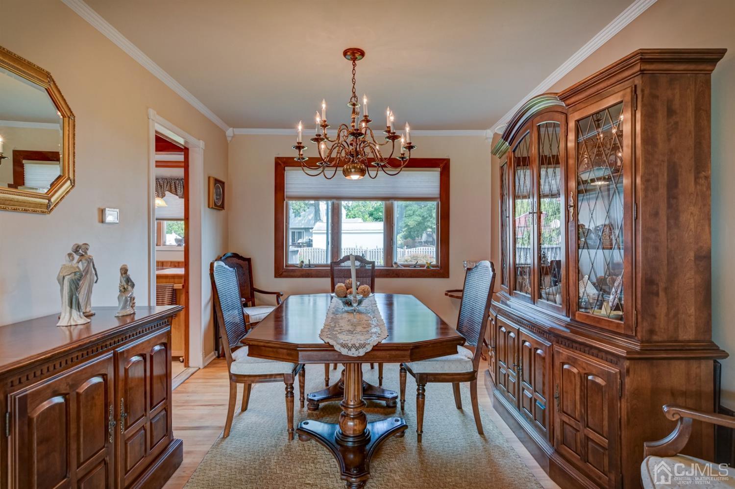 19 Chelsea Road Old Bridge, NJ 08857 - Photo 11 of 34 a dining room with furniture a chandelier and wooden floor