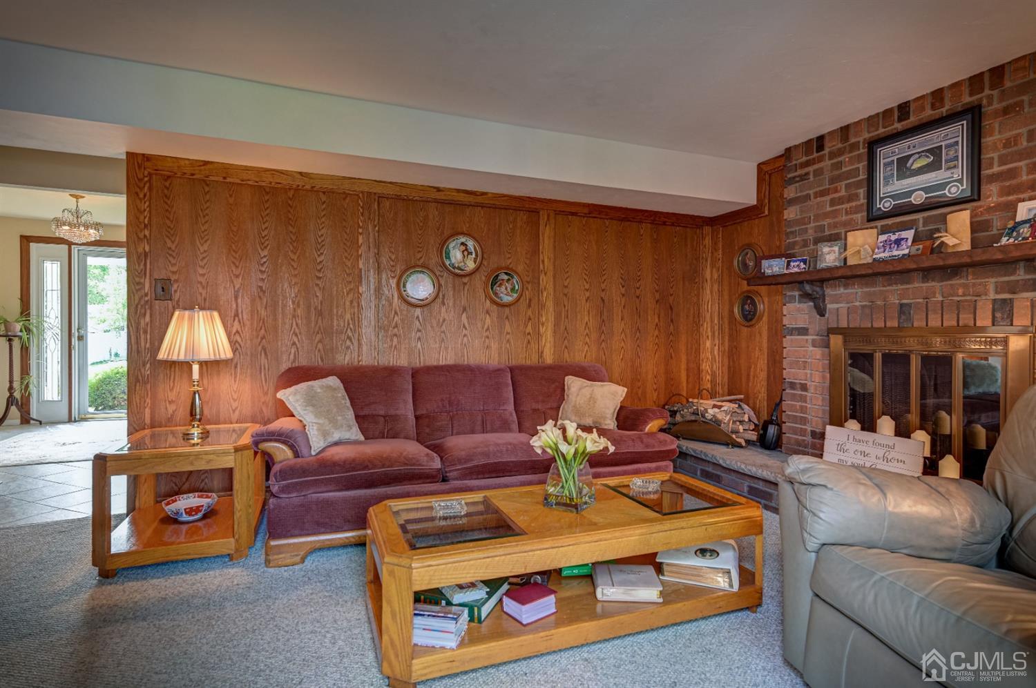 19 Chelsea Road Old Bridge, NJ 08857 - Photo 26 of 34 a living room with furniture a lamp and a fireplace