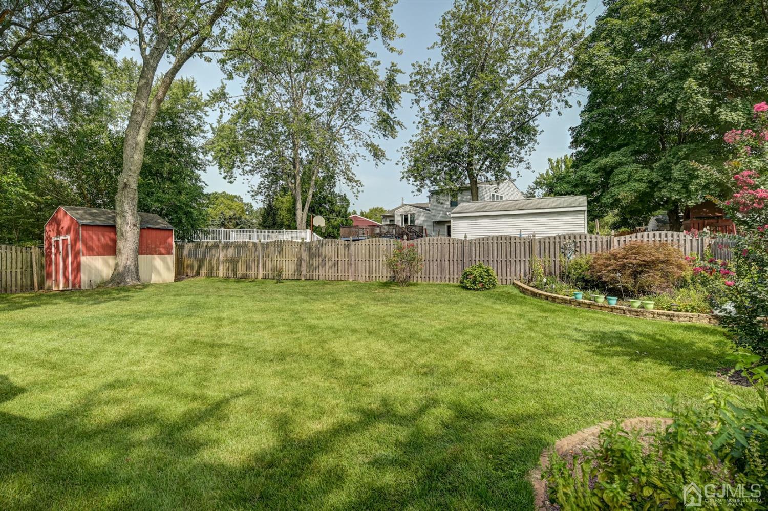 19 Chelsea Road Old Bridge, NJ 08857 - Photo 34 of 34 a view of a backyard with a garden
