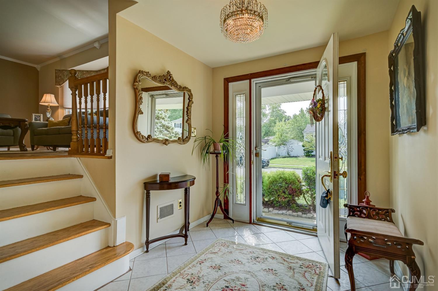 19 Chelsea Road Old Bridge, NJ 08857 - Photo 6 of 34 a view of a hallway with wooden floor and windows