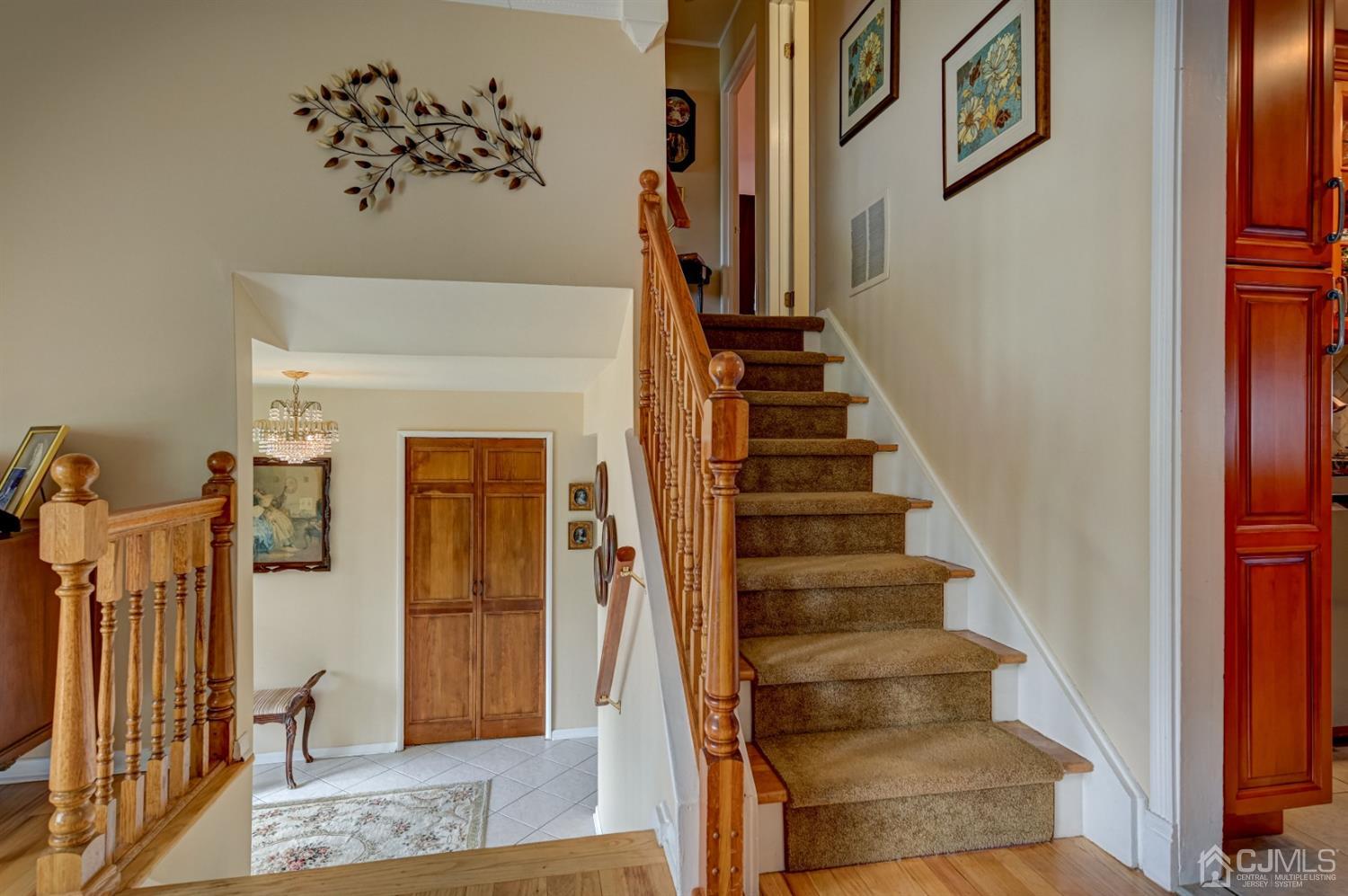 19 Chelsea Road Old Bridge, NJ 08857 - Photo 7 of 34 a view of staircase with white walls and a window