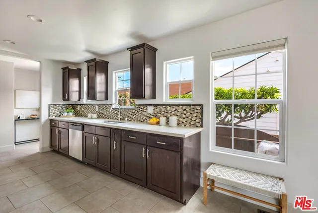 a spacious bathroom with a granite countertop tub and a sink