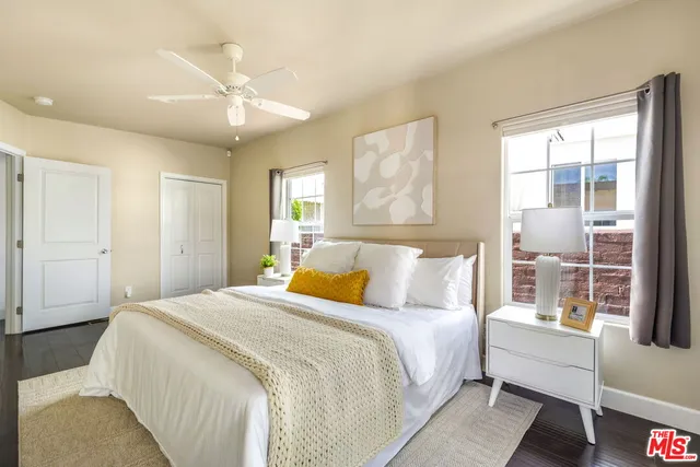 a bedroom with a large bed and a window