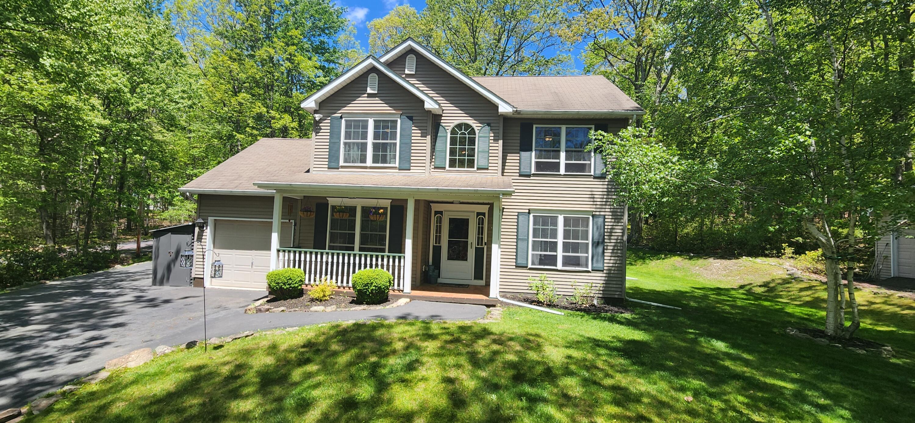 1729 Hemlock Drive Scotrun, PA 18355 - Photo 1 of 21 a view of a house with backyard and porch