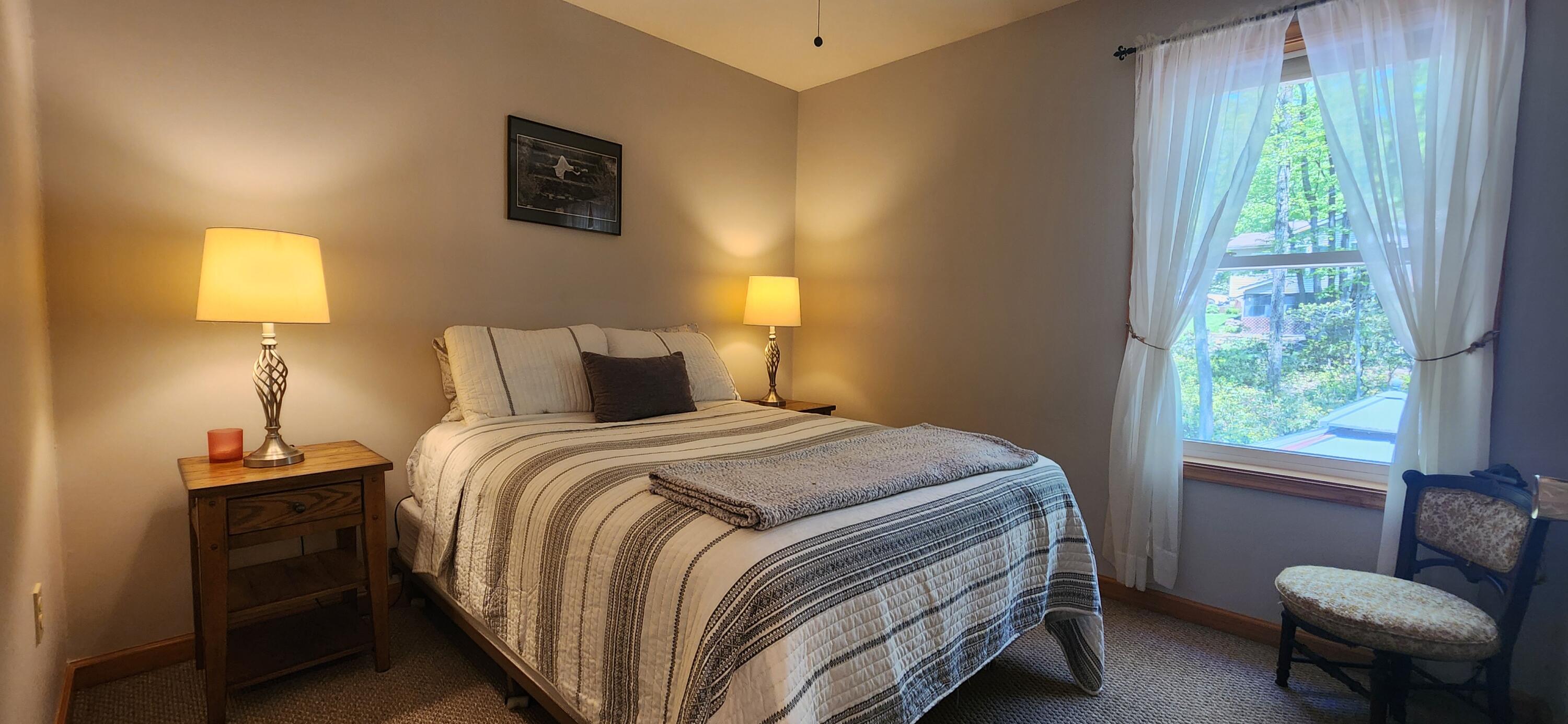 1729 Hemlock Drive Scotrun, PA 18355 - Photo 15 of 21 a bedroom with a bed and a chair