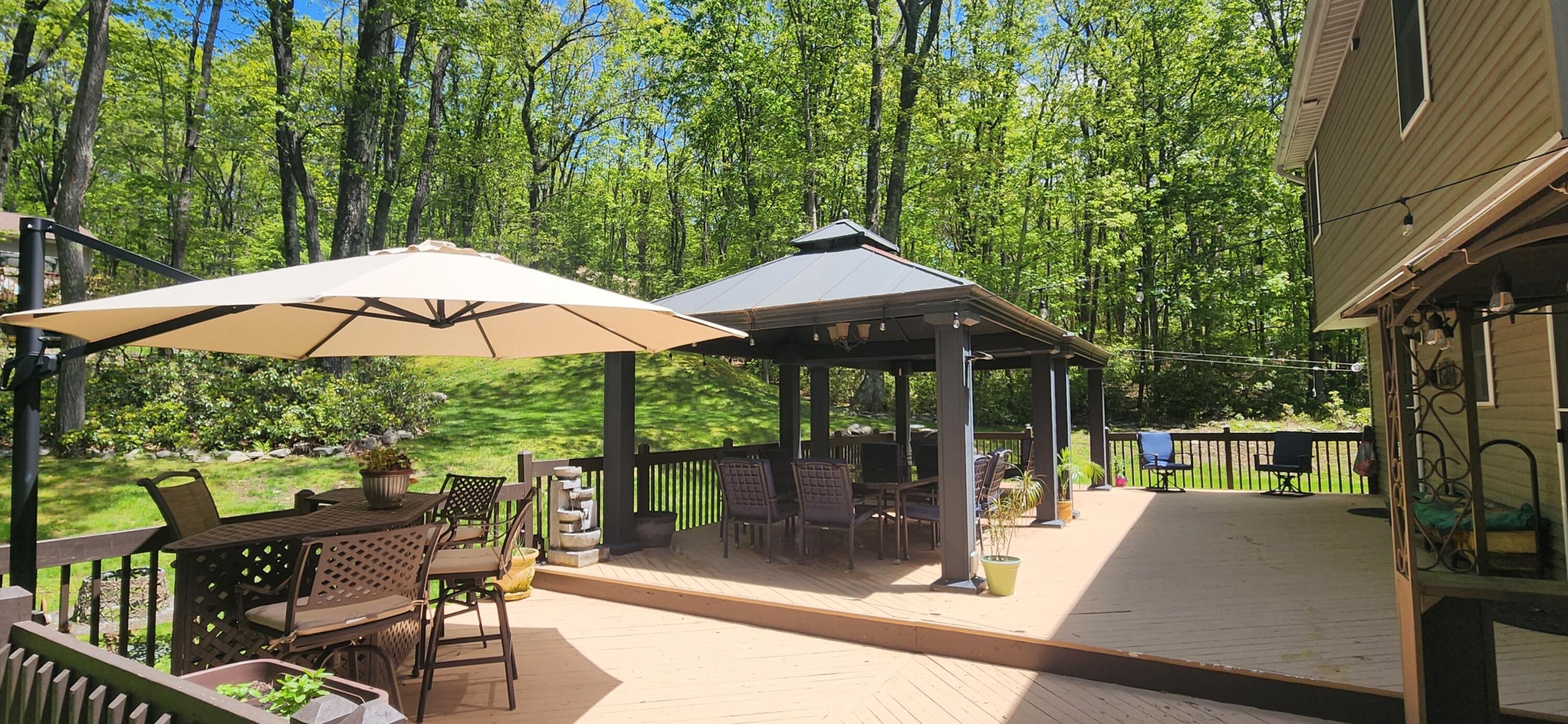 1729 Hemlock Drive Scotrun, PA 18355 - Photo 17 of 21 a view of outdoor space yard deck patio and outdoor kitchen
