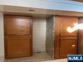 1518 River Road, Unit 3 Edgewater, NJ 07020 - Photo 11 of 19 a view of kitchen with granite countertop cabinets