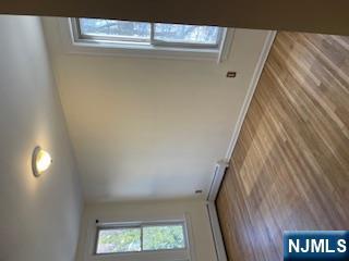 1518 River Road, Unit 3 Edgewater, NJ 07020 - Photo 14 of 19 an empty room with wooden floor and windows