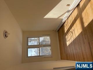 1518 River Road, Unit 3 Edgewater, NJ 07020 - Photo 16 of 19 a view of an empty room and window