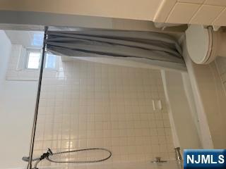 1518 River Road, Unit 3 Edgewater, NJ 07020 - Photo 18 of 19 a bathroom with a shower and a toilet
