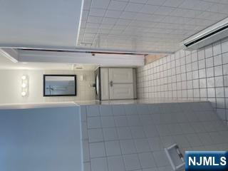 1518 River Road, Unit 3 Edgewater, NJ 07020 - Photo 19 of 19 a bathroom with a sink a toilet and mirror