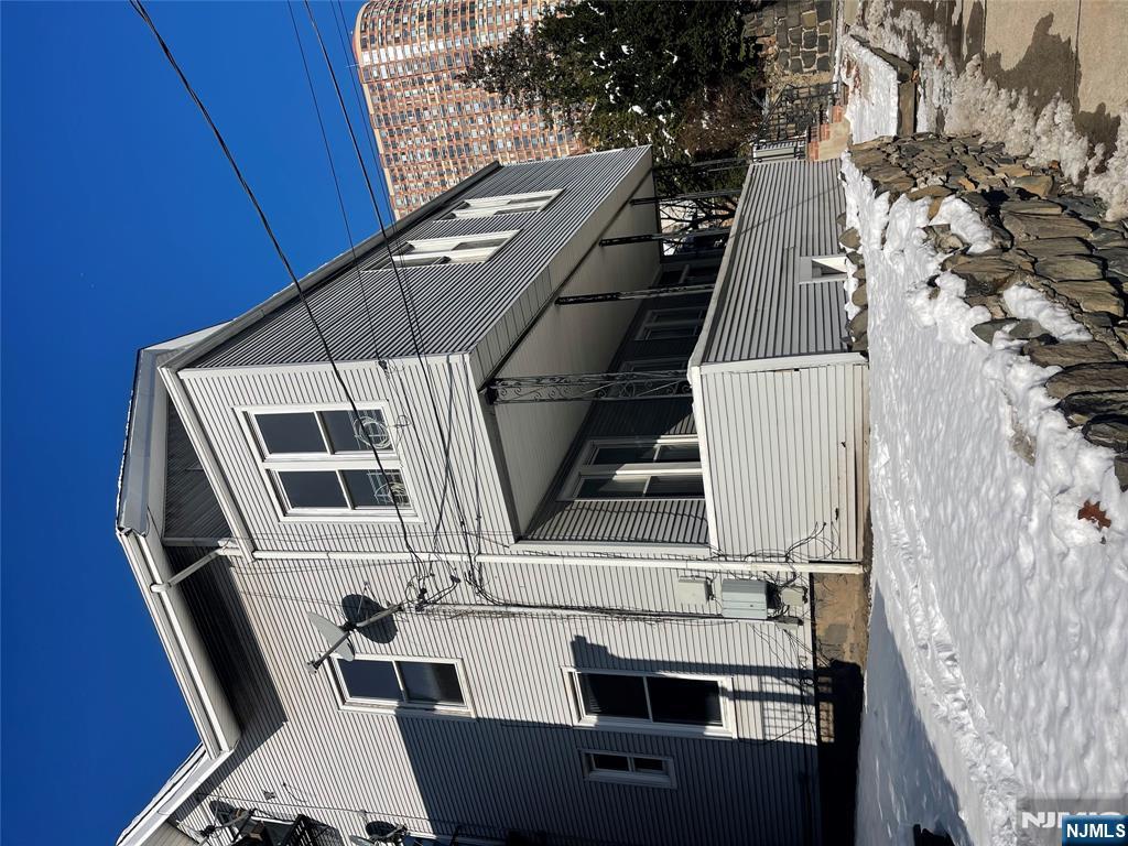 1518 River Road, Unit 3 Edgewater, NJ 07020 - Photo 2 of 19 a view of a house with a yard