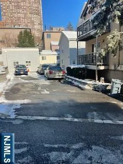 a view of a street with cars