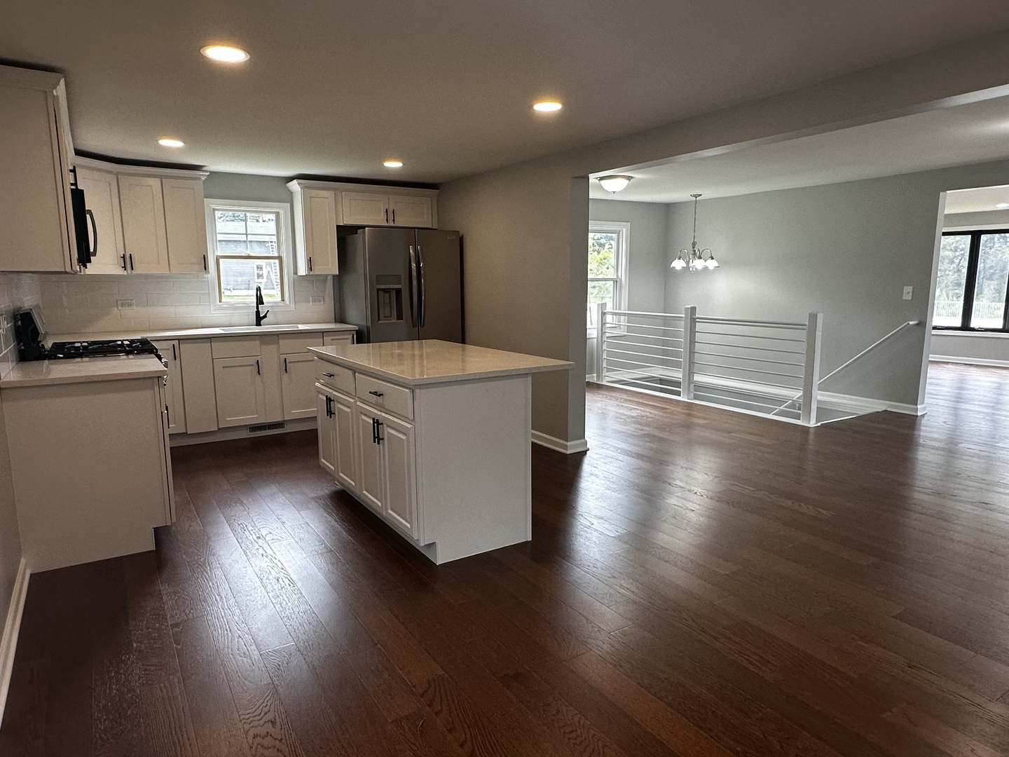 764 Brooklyn Road West Brooklyn, IL 61378 - Photo 15 of 33 a kitchen with wooden floors and white cabinets