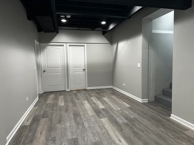 an empty room with wooden floor