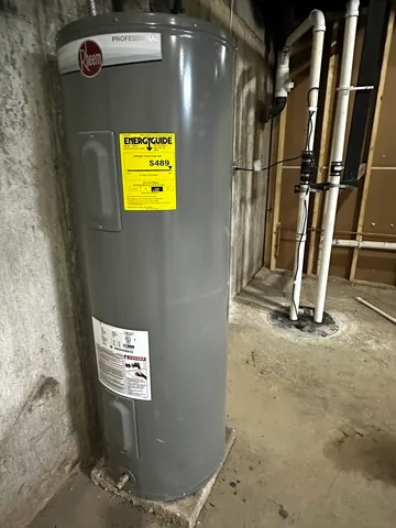 a kitchen with a sink a wooden floor and a cabinet
