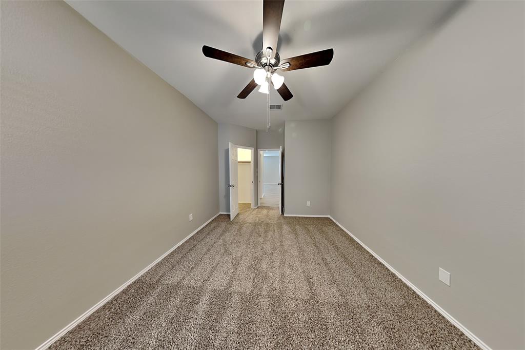 1056 Pullman Drive Saginaw, TX 76131 - Photo 20 of 27 a view of an empty room and chandelier fan