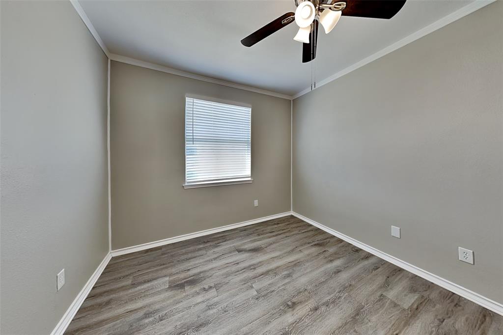 1056 Pullman Drive Saginaw, TX 76131 - Photo 24 of 27 wooden floor in an empty room with a window