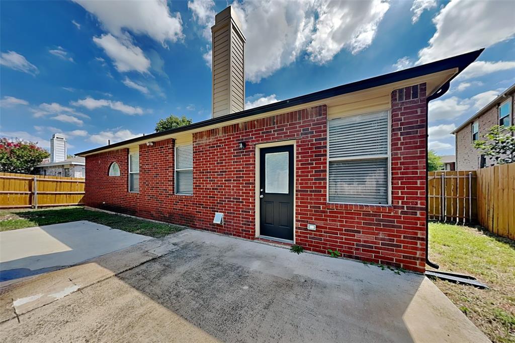 1056 Pullman Drive Saginaw, TX 76131 - Photo 26 of 27 a front view of a house with garden